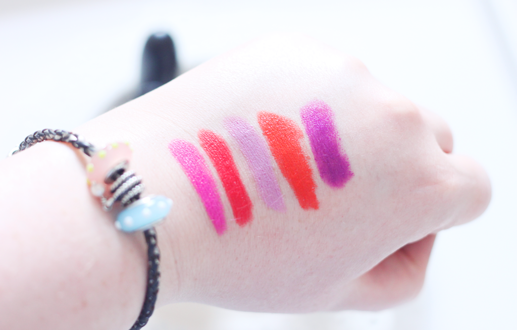 Swatches of MAC Cosmetics Violetta, Morange; KISStick Toxic Kiss; Rimmel Kate Moss 110