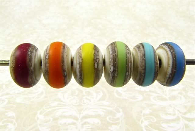 rainbow set of etched ivory glass and silver beads