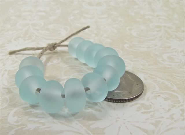 Get away to the beach!  A dozen "sea glass" beads in pale blue